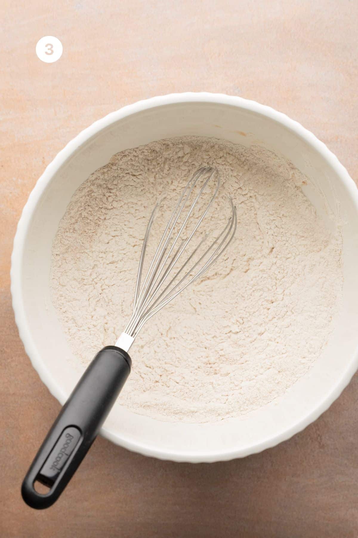 Whisked flour, baking soda, baking powder, salt and cinnamon in a large bowl with a whisk. 