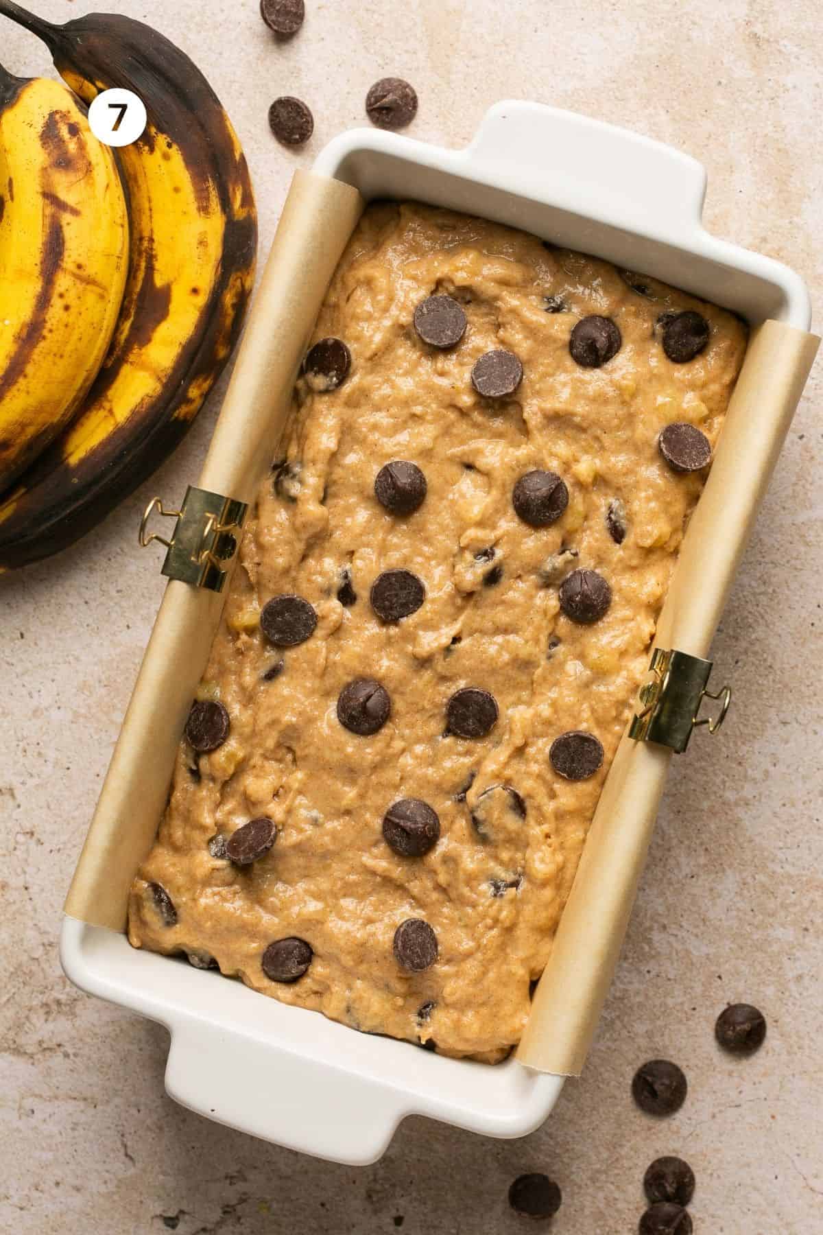 Banana bread batter poured into a 9x5-inch loaf pan to bake. 
