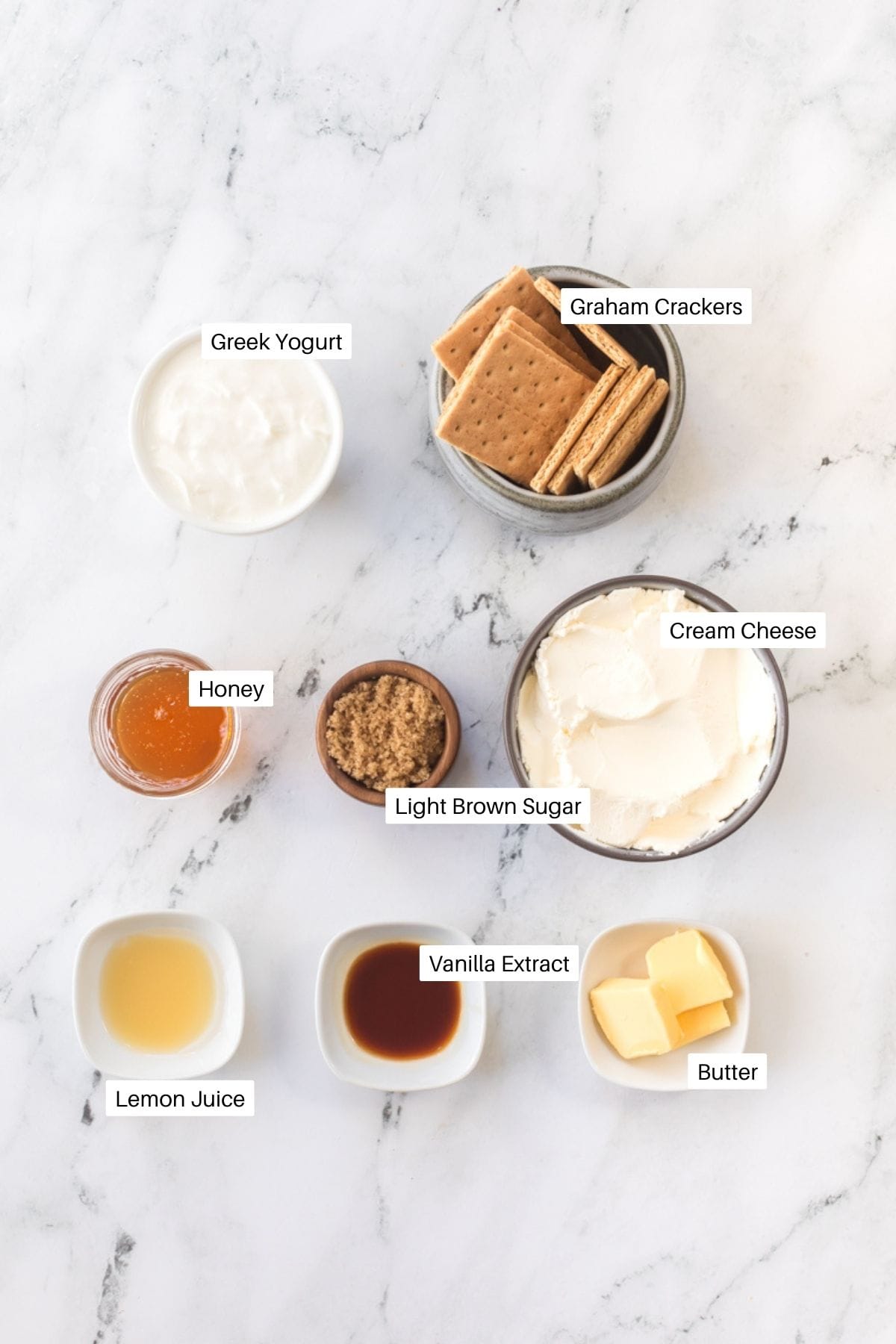 Greek yogurt, cream cheese, graham crackers, brown sugar, honey, vanilla, lemon and butter for cheesecake cups. 