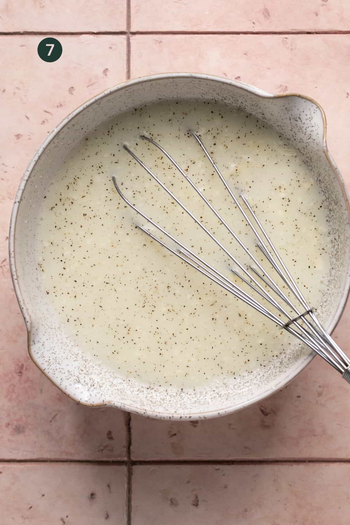Liquid egg whites, milk, cheese, salt and pepper whisked in a large bowl. 