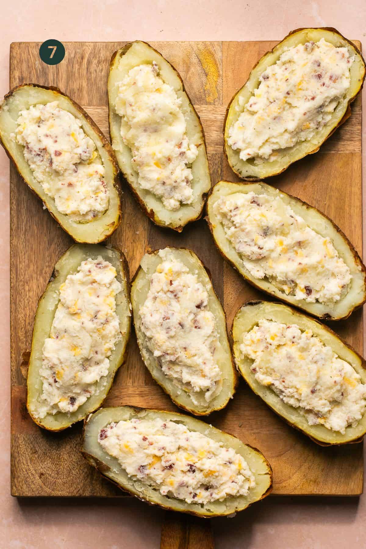 Mashed potatoes loaded into potato skins. 