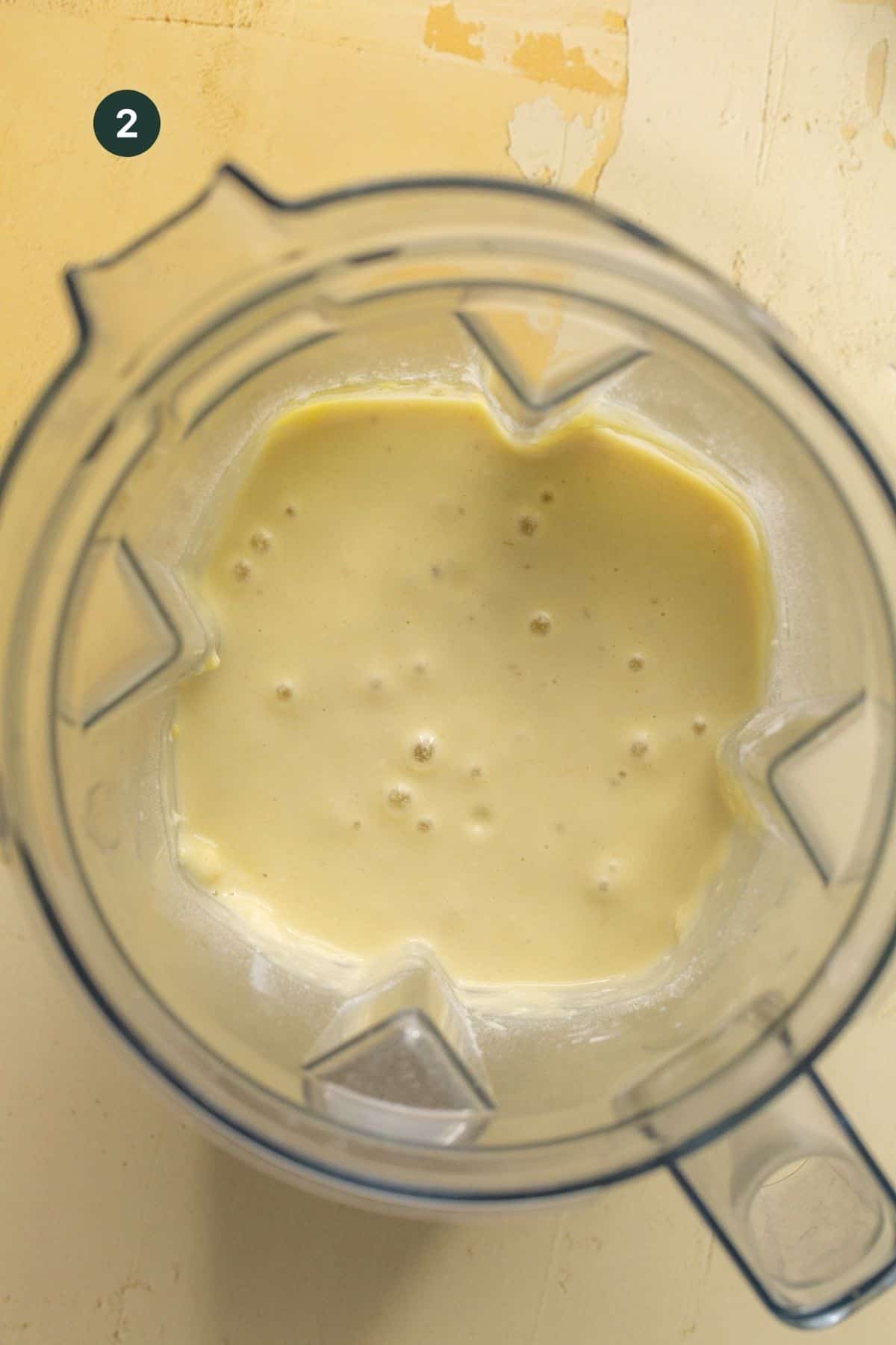 Waffle batter combined in a blender.