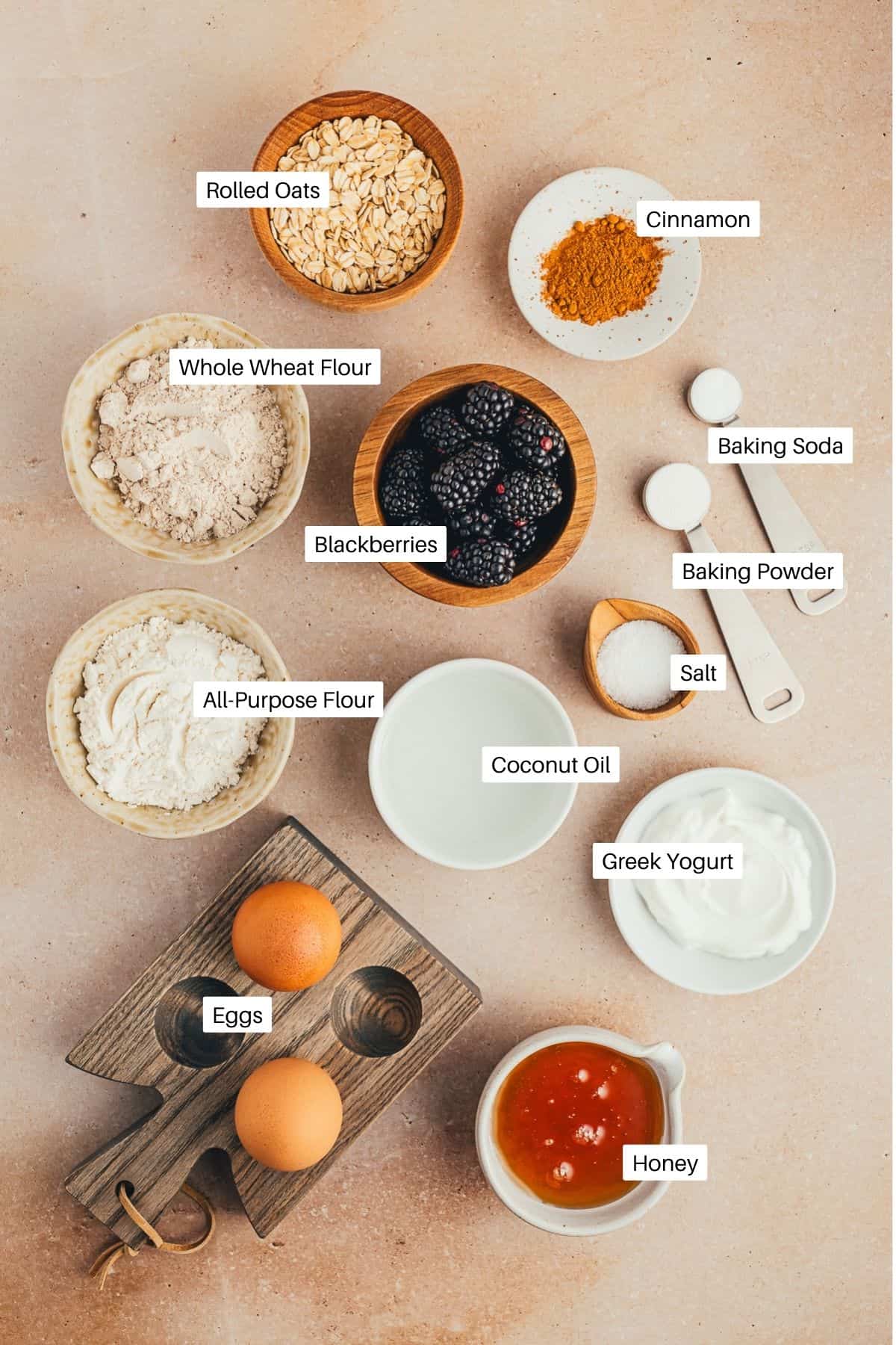 Oats, flours, salt, baking soda, baking powder, honey, cinnamon, blackberries, eggs, and greek yogurt for muffins. 