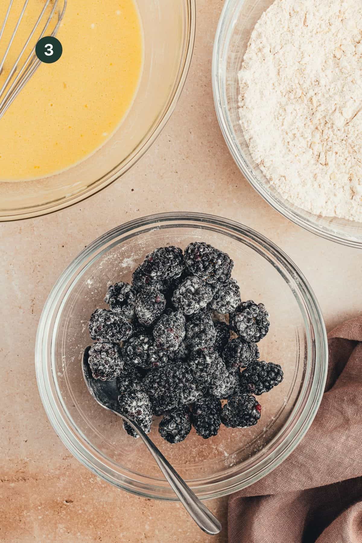 Blackberries coated in flour in a bowl.