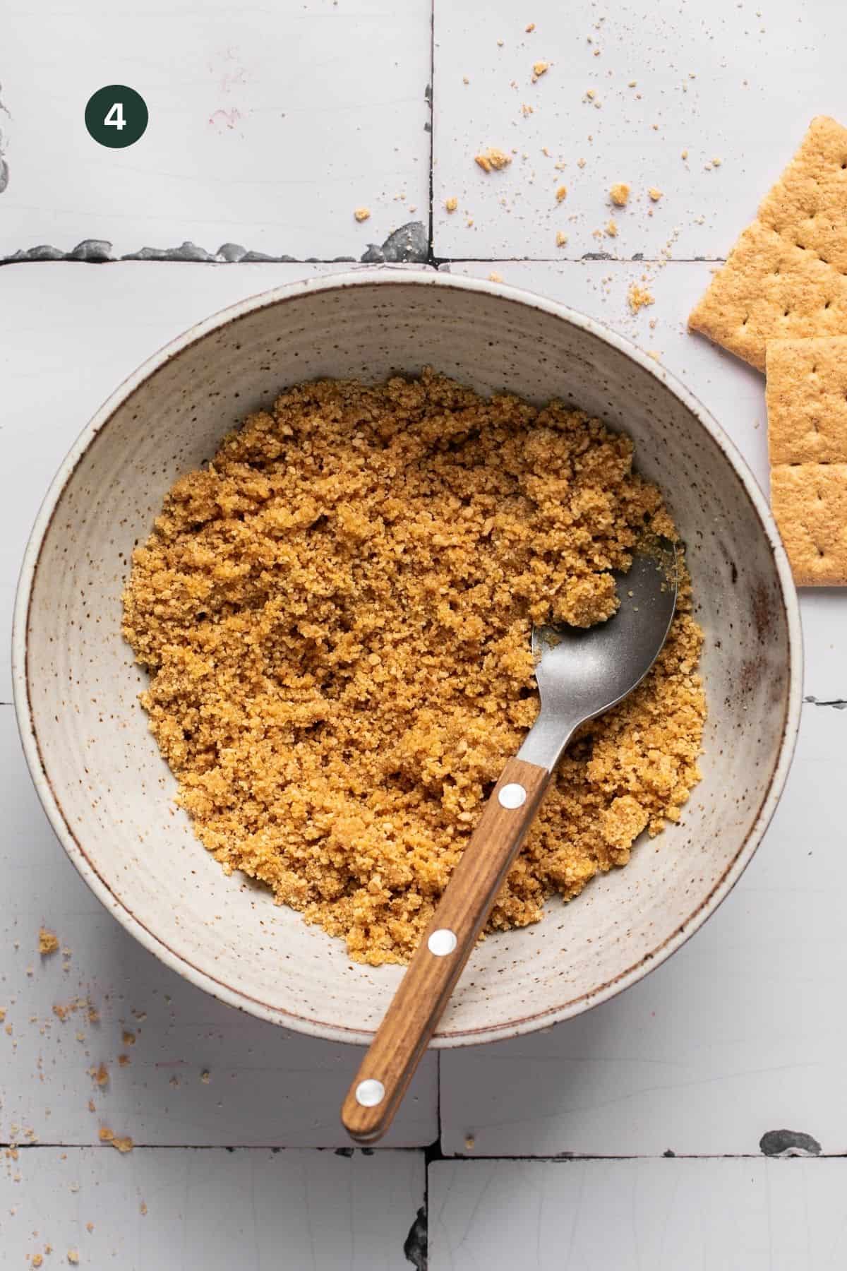 Melted coconut oil mixed into graham cracker crumbs to make a wet sand.