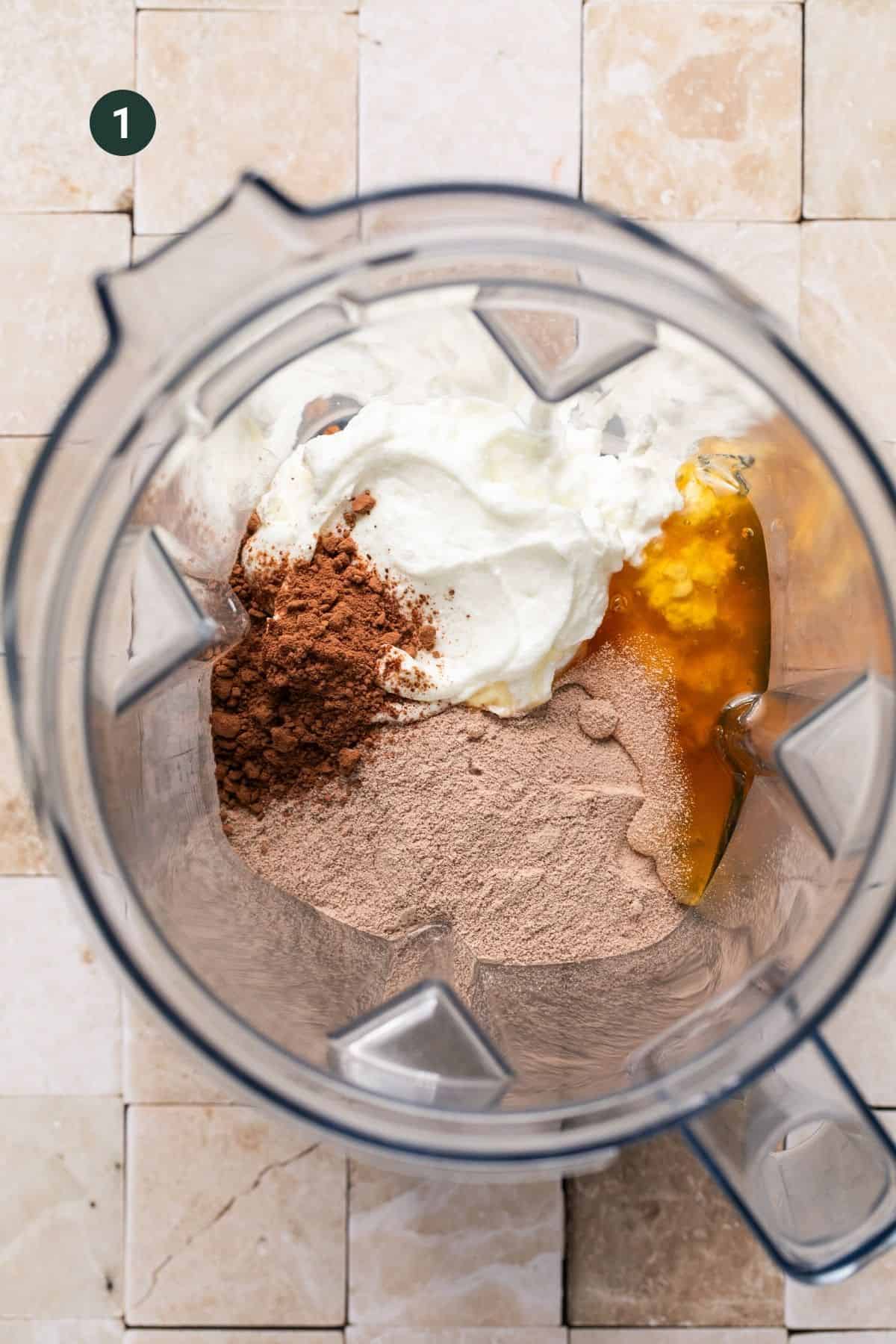 Cottage cheese, greek yogurt, protein powder, cocoa powder and honey in a blender.