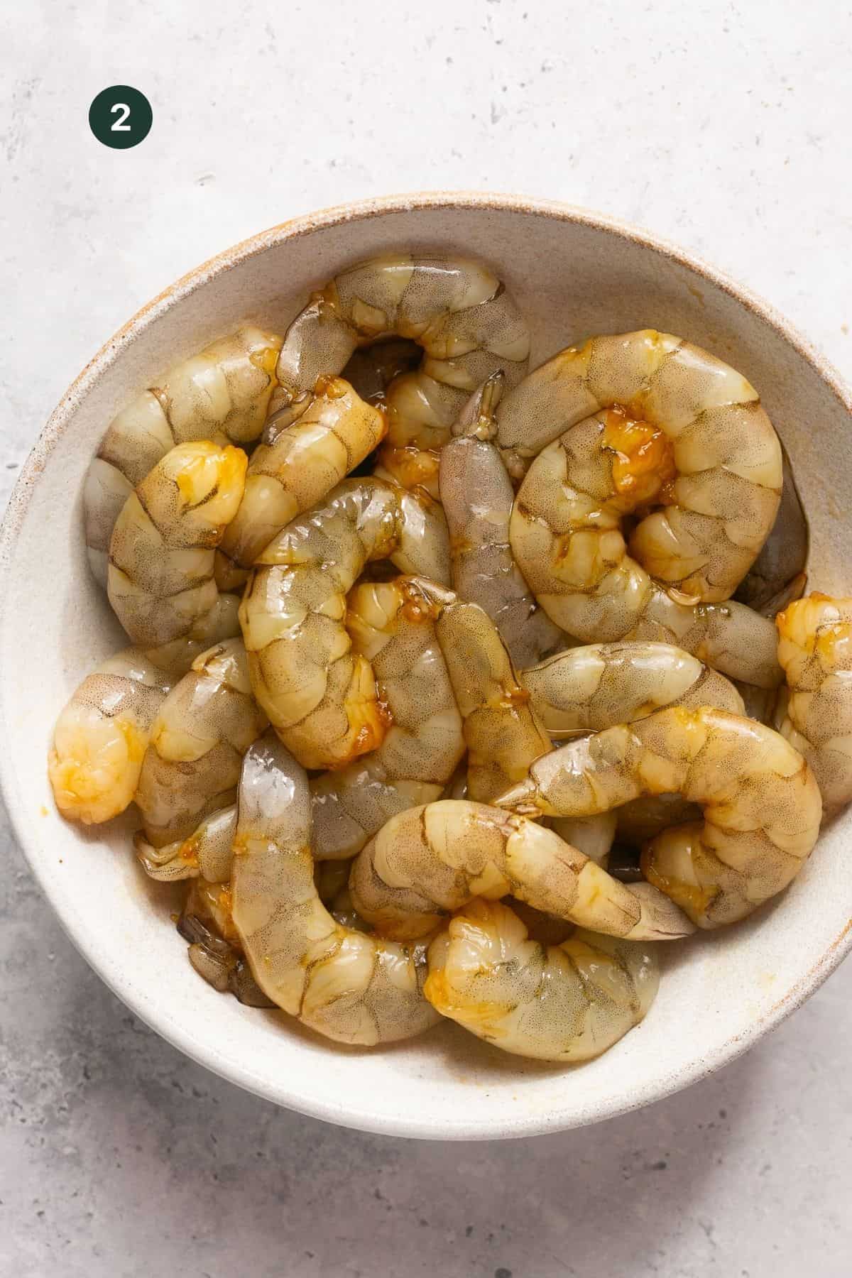 Marinated shrimp in a bowl.