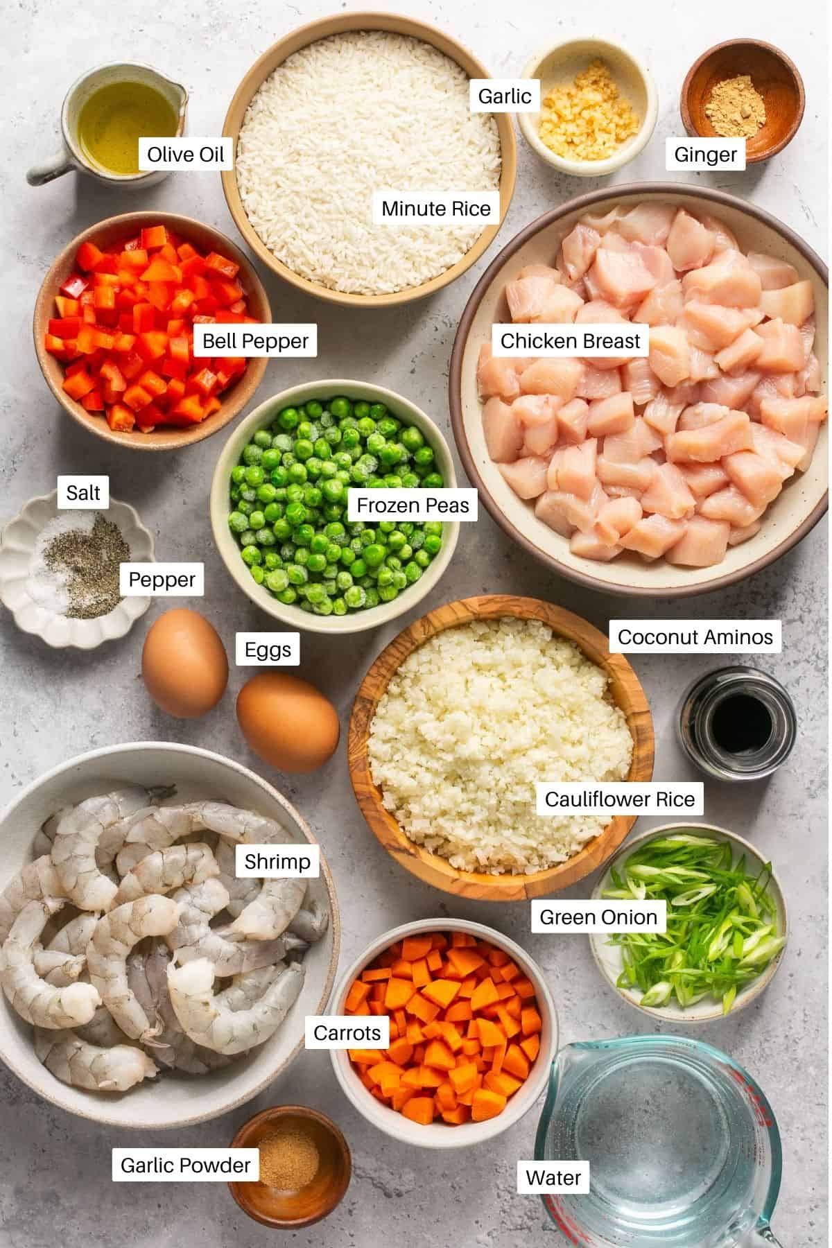 Chicken, shrimp, peas, carrots, bell peppers, white rice, cauliflower rice, green onions, garlic, garlic powder, ginger, salt, pepper, coconut aminos and eggs for fried rice. 