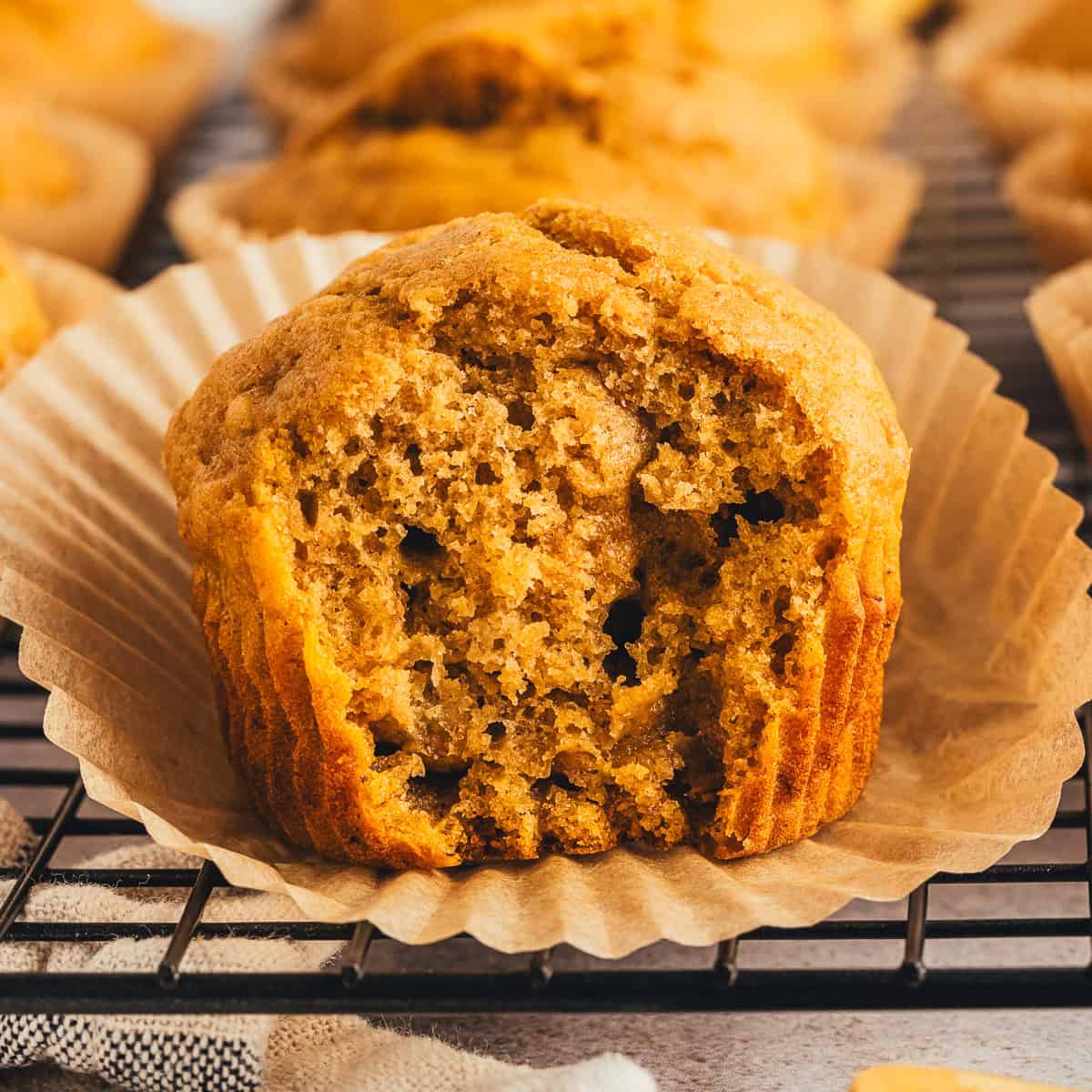 Inside of a pumpkin banana muffin with the wrapper peeled back.