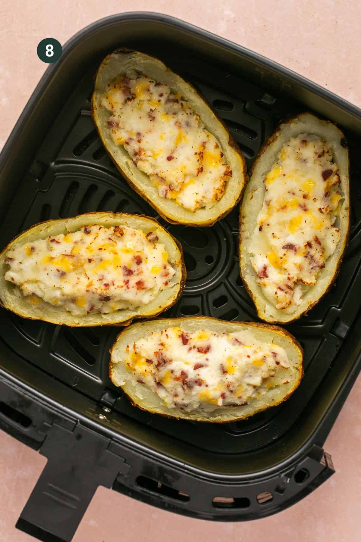 Loaded twice baked potatoes in the  basked of the air fryer. 