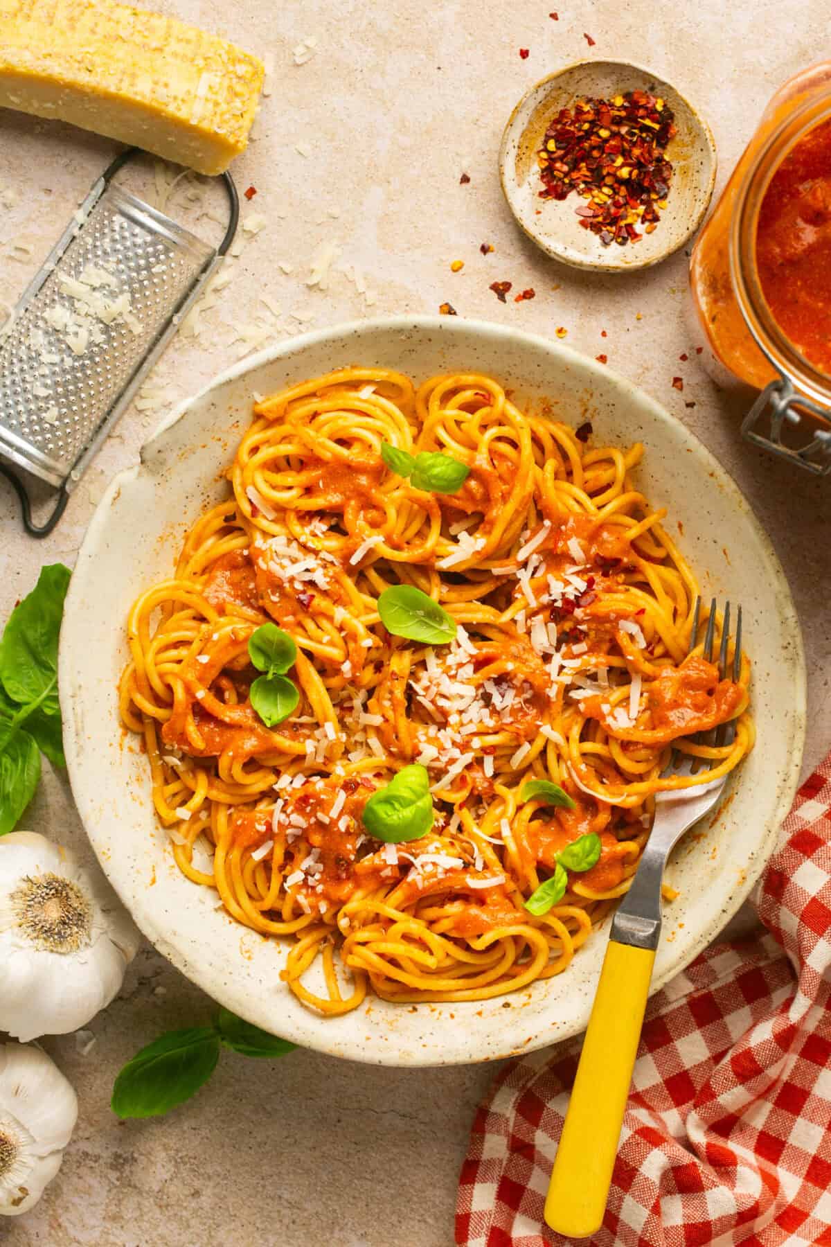 Spaghetti noodles topped with cottage cheese pasta sauce and fresh basil and parmesan cheese. 