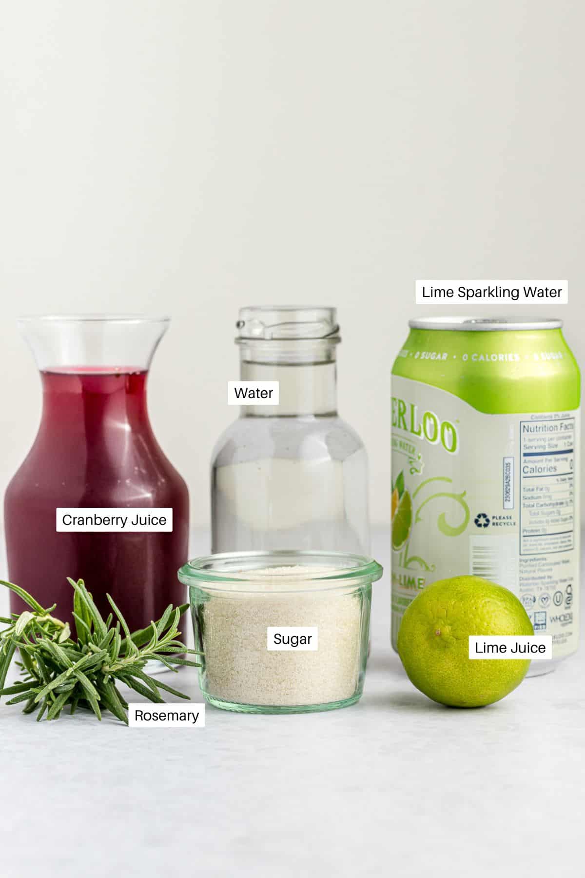 Cranberry juice, fresh spring of rosemary, water, lime seltzer water, fresh lime and sugar for mocktails. 