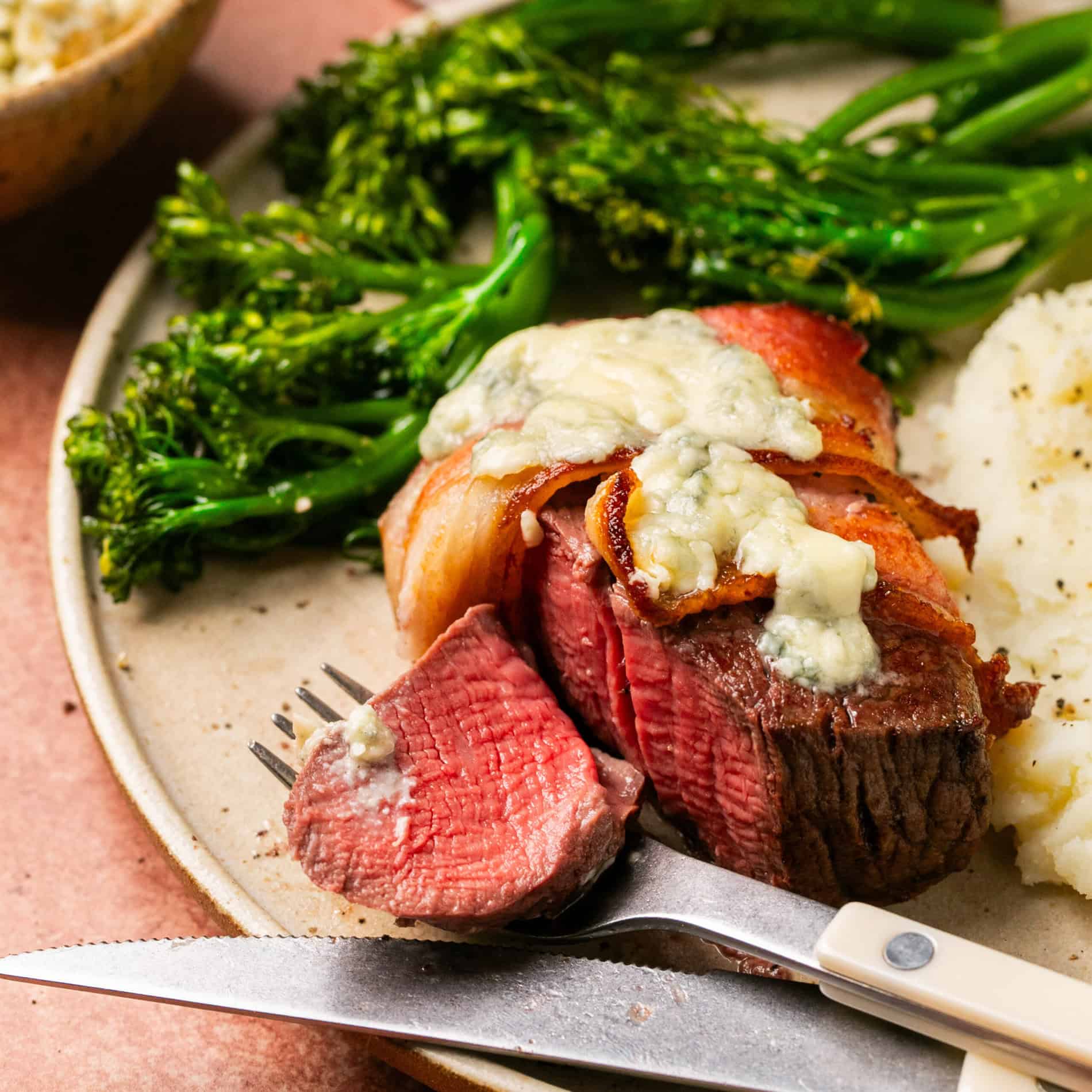 Picture of filet mignon with a slice cut out.