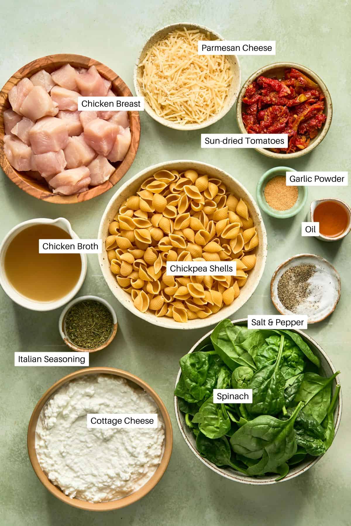 Chicken breast, parmesan cheese, sundried tomatoes, chicken broth, chickpea shells, garlic powder, oil from sundried tomatoes, italian seasoning. salt and pepper, cottage cheese and spinach for pasta.