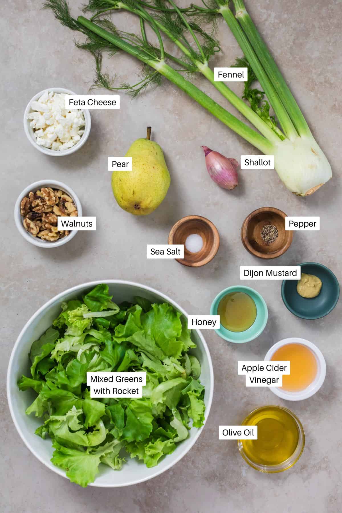 Mixed greens, fennel. pear, shallow, salt, pepper, dijon mustard, honey, apple cider vinegar, olive oil, walnuts and feta for rocket salads. 