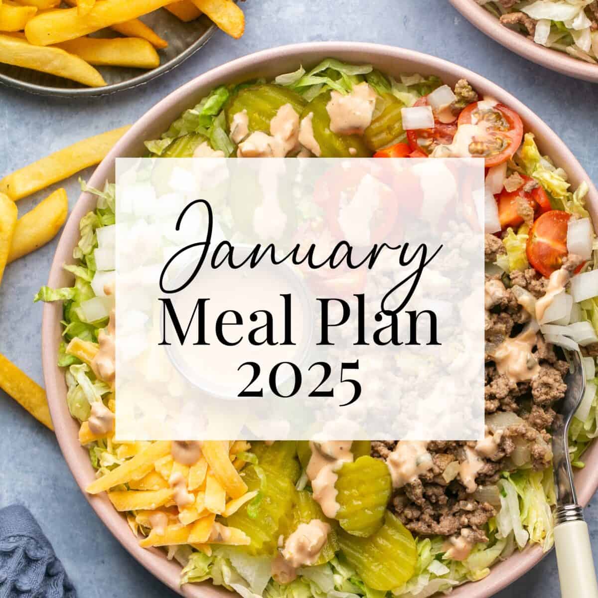 A text overlay reads January Meal Plan 2025 on an image featuring a bowl of salad topped with ground meat, cherry tomatoes, pickles, onions, and dressing. French fries are visible in the background.