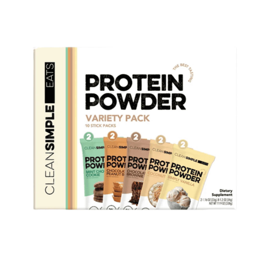 A box of Clean Simple Eats Protein Powder Variety Pack, featuring ten stick packs in assorted flavors including chocolate, peanut butter, coconut, and simply vanilla. The packaging is white with colorful accents.