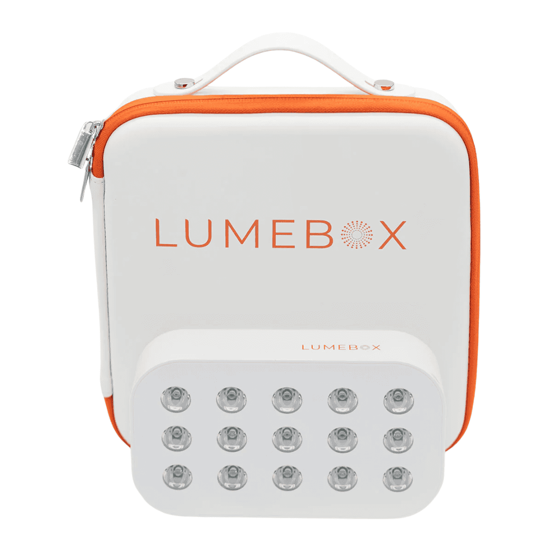 A white and orange carrying case labeled LUMEBOX with a matching rectangular device featuring two rows of six round LED lights each, positioned in front of the case.