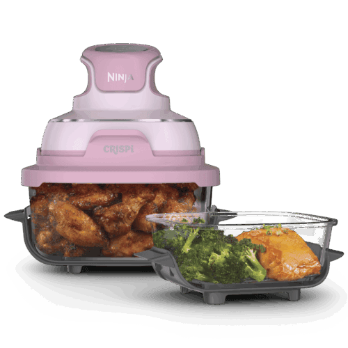 Ninja Crispi portable glass air fryer in cherry blossom pink with glass containers of chicken wings, broccoli, and salmon