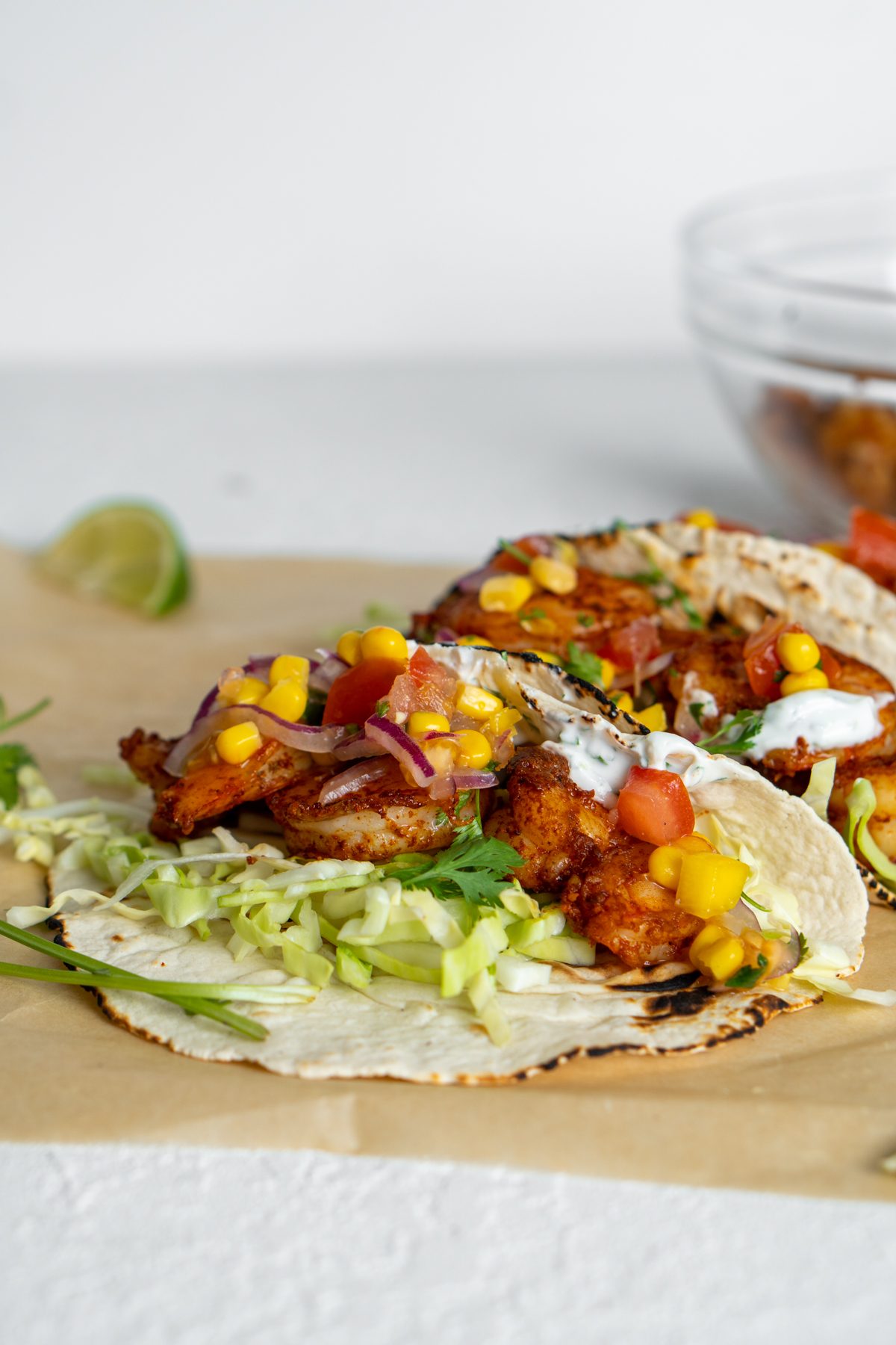 Mango corn salsa atop shrimp tacos.