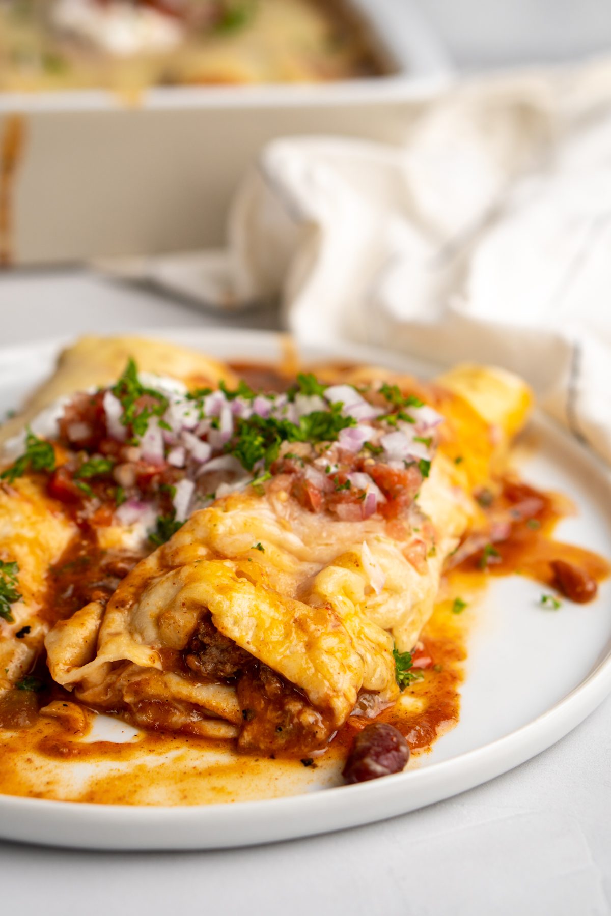 Chili Cheese Enchiladas on a plate.