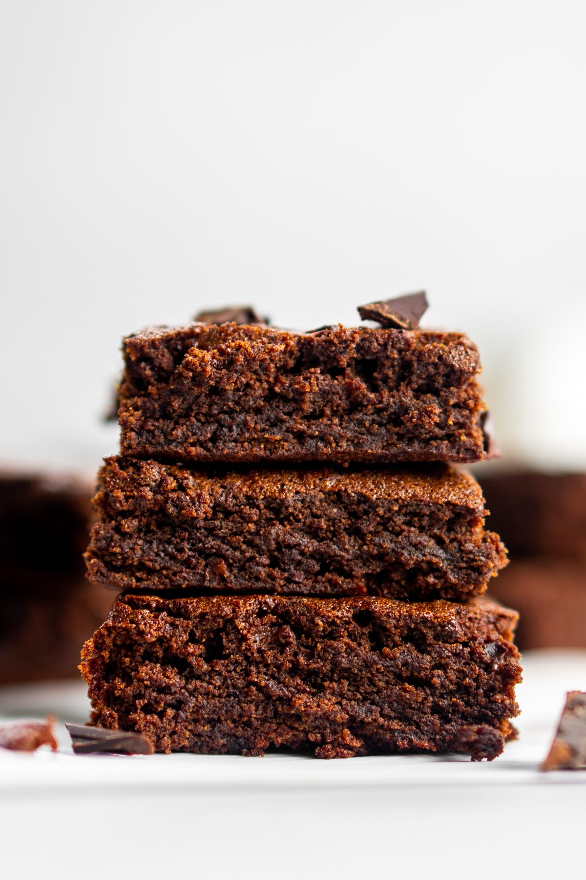 Stack of three crunchy mint chocolate brownies.