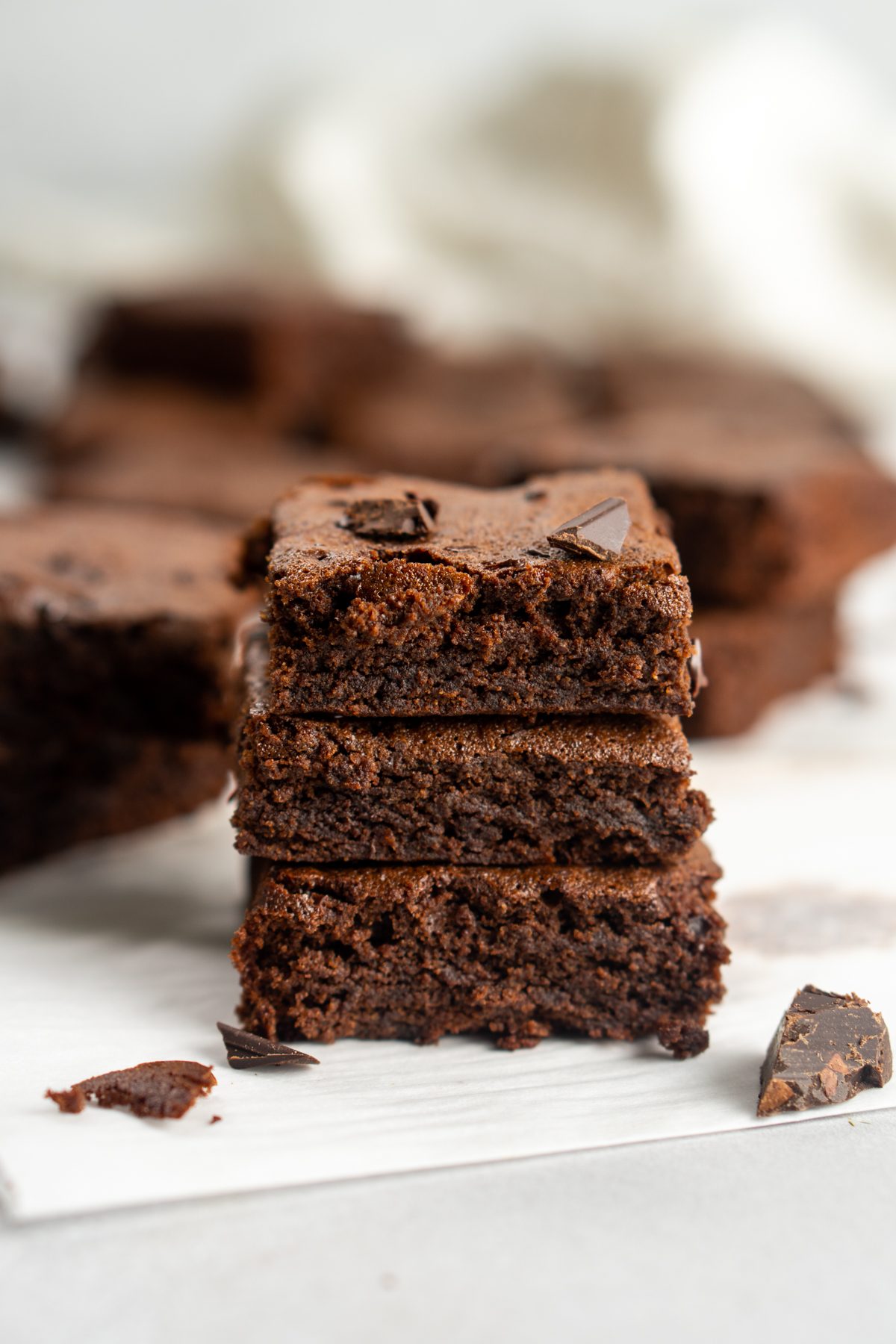 Stack of three crunchy mint chocolate brownies.