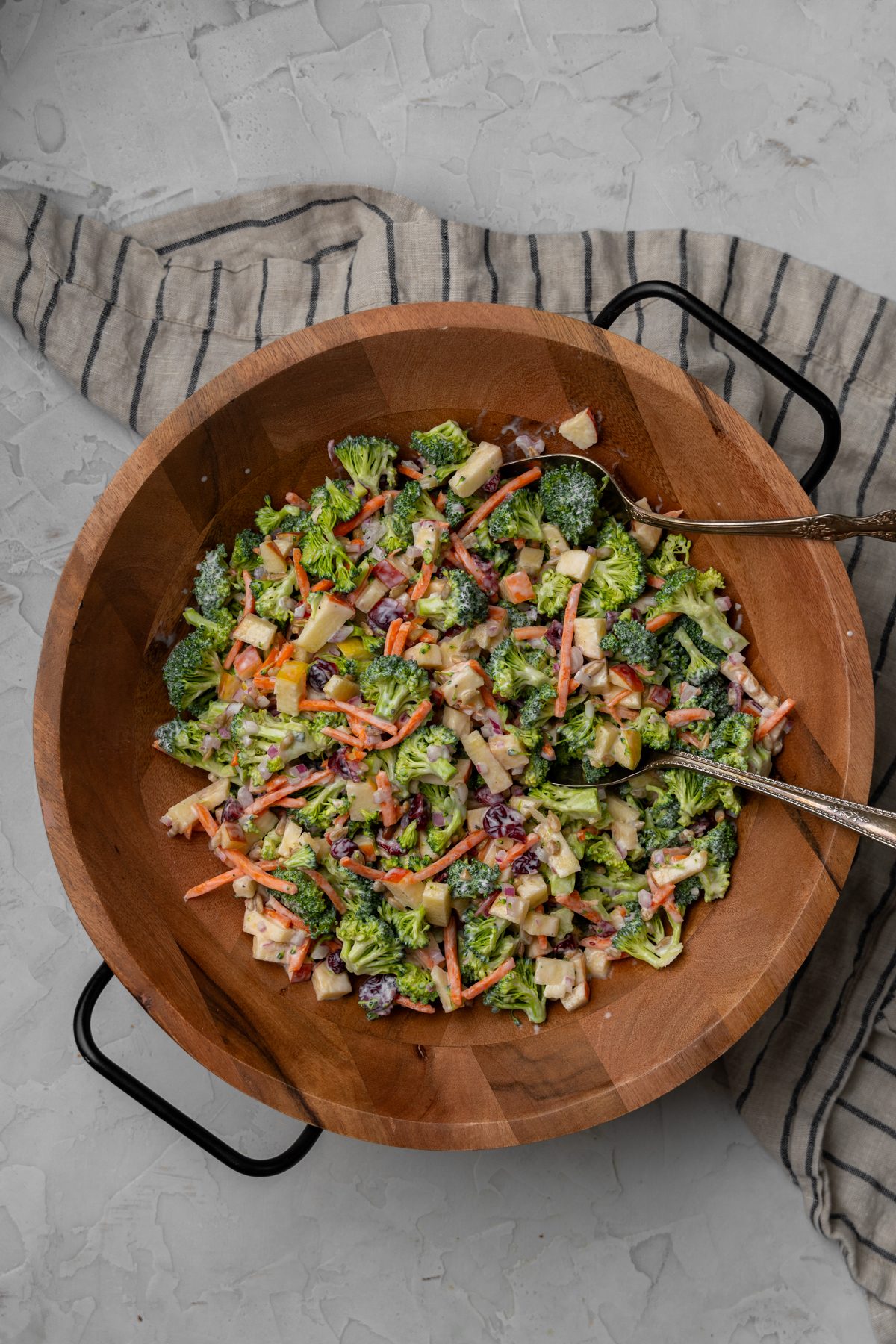 Colorful broccoli crunch salad in a wooden bowl.