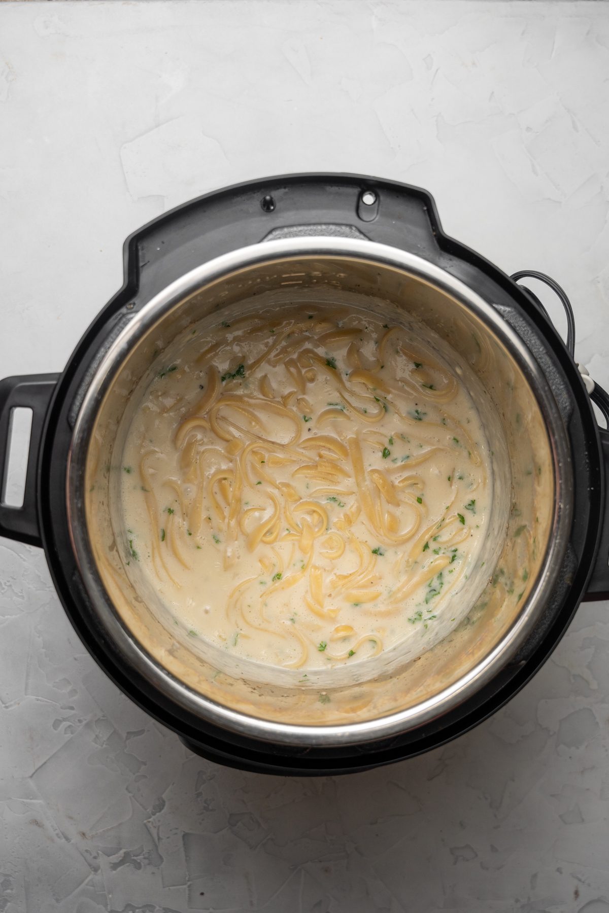 Fettucine alfredo in an Instant Pot without a lid.